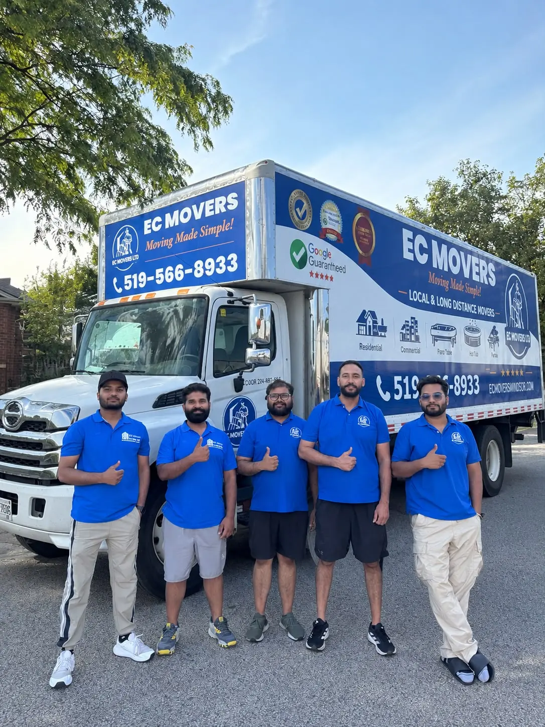 The EC Movers crew in front of the truck