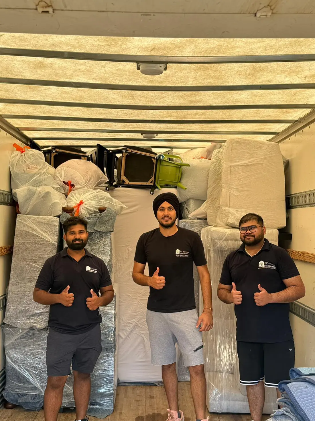 EC Movers crew in a truck loaded and padded for a move