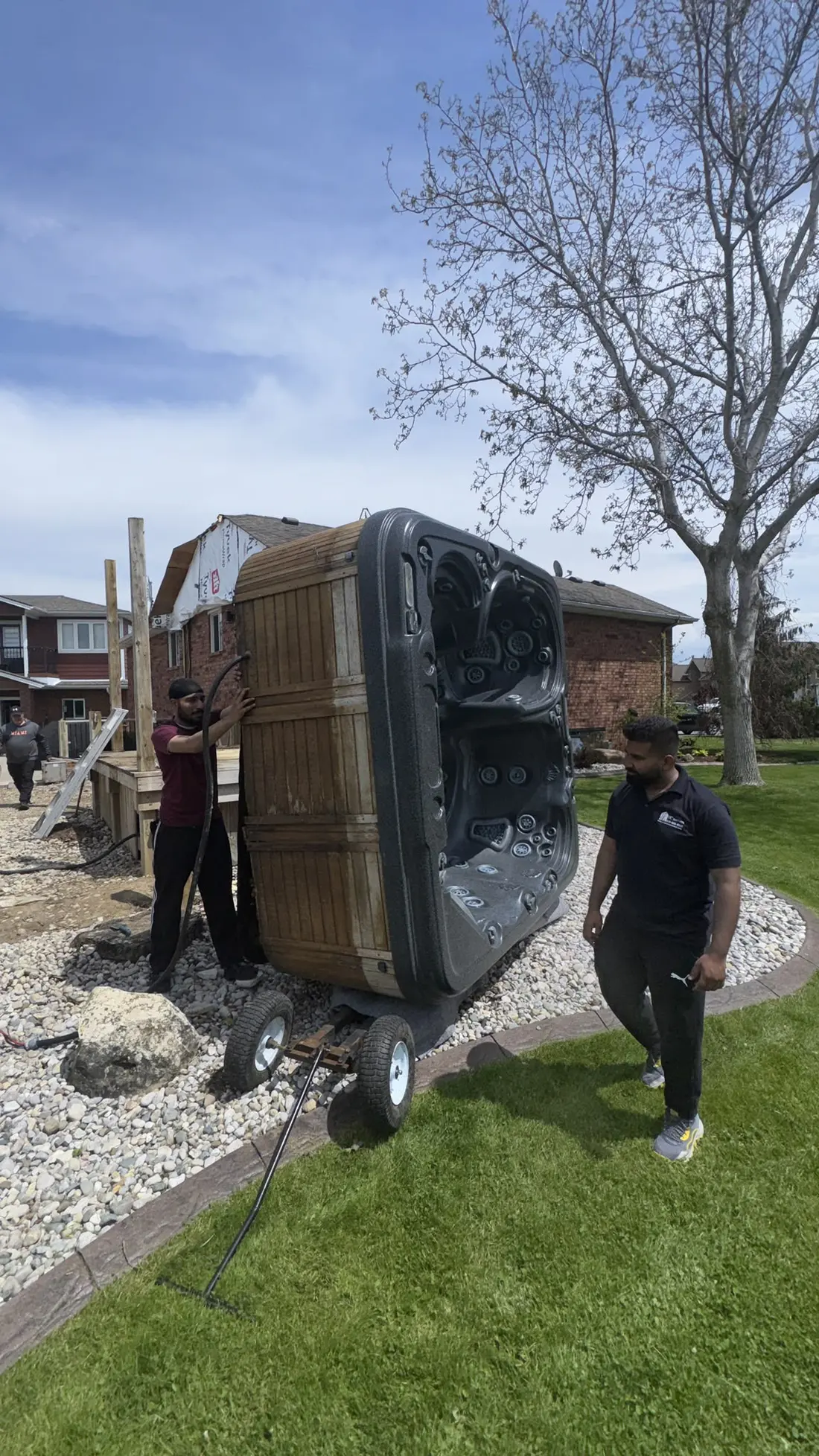 Hot tub on a dolly across a lawn