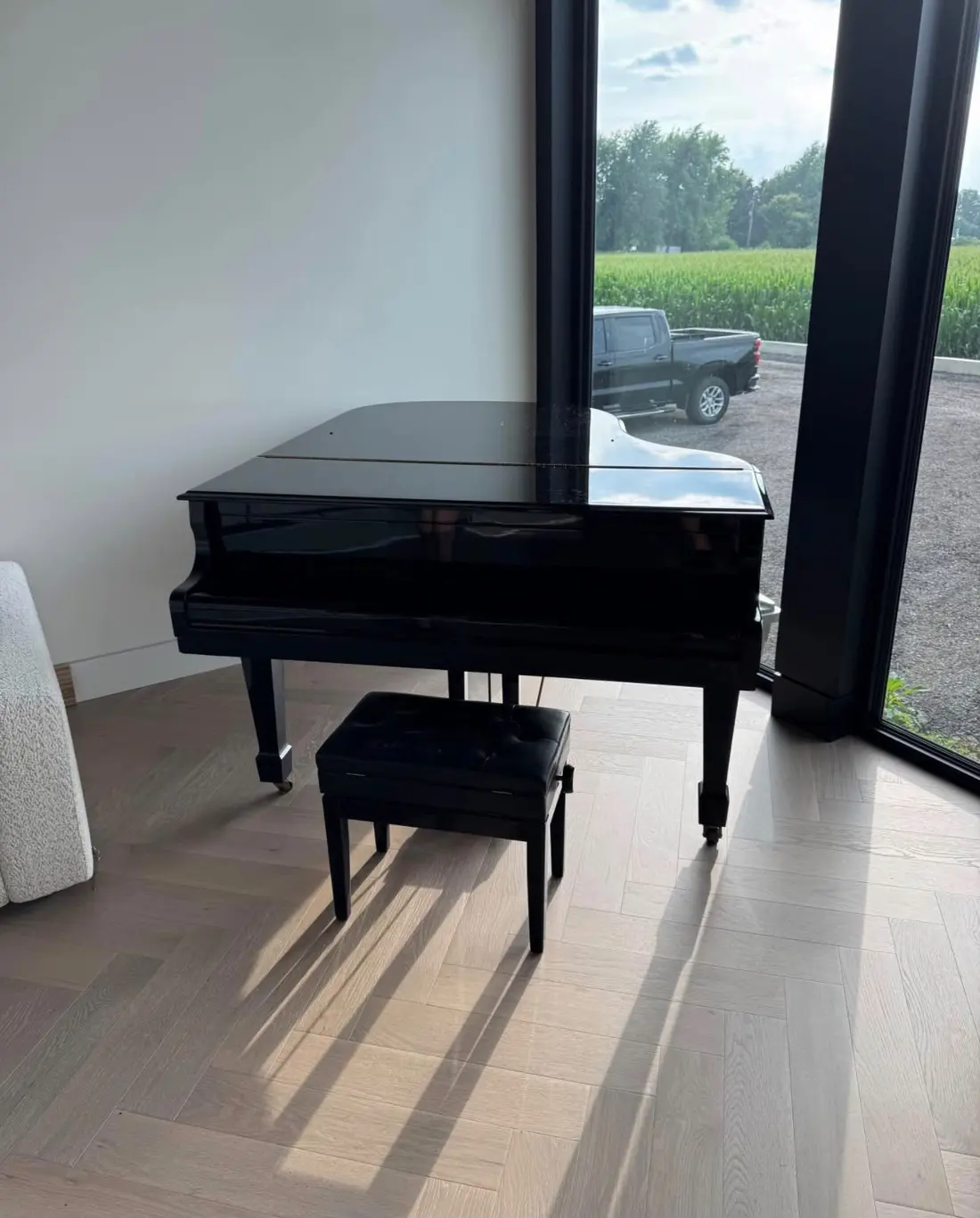 Grand piano in place by a window