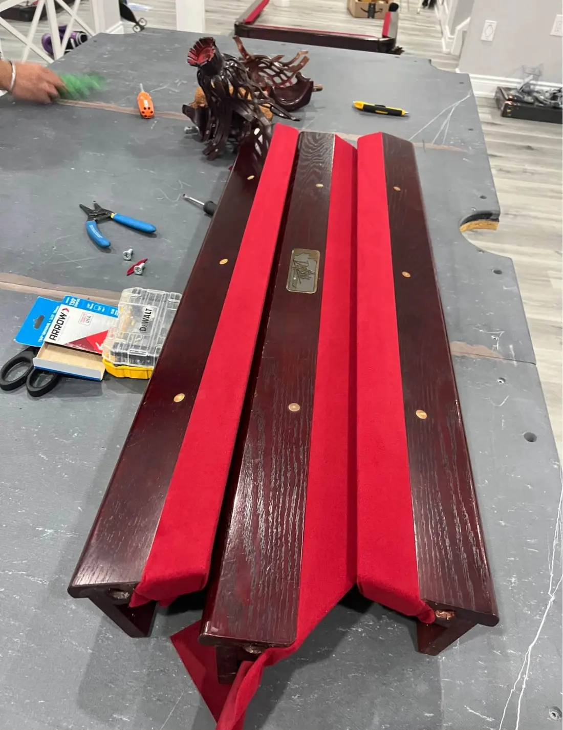 Pool table rails re-covered with new red cloth