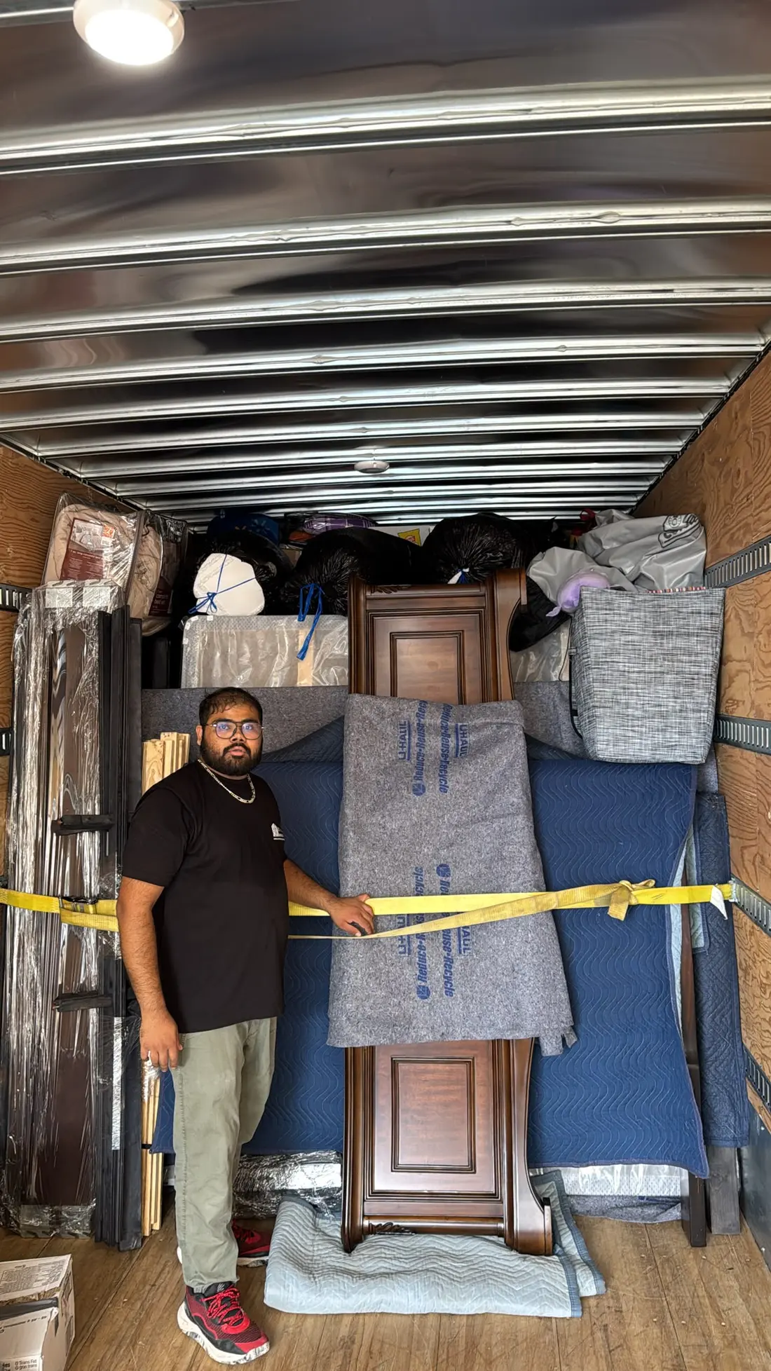 Inside the truck with padded furniture and straps