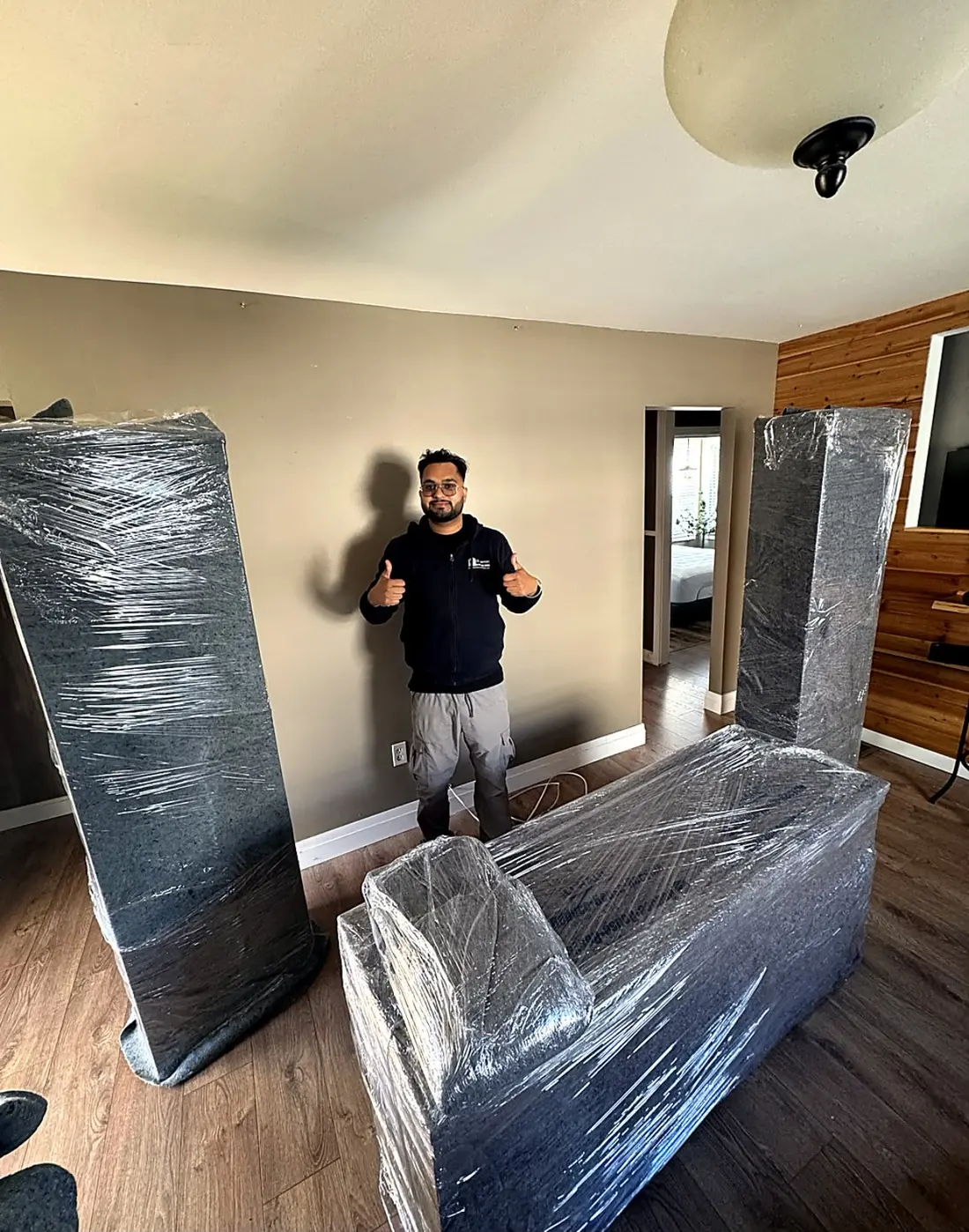 Furniture wrapped in a living room before a move