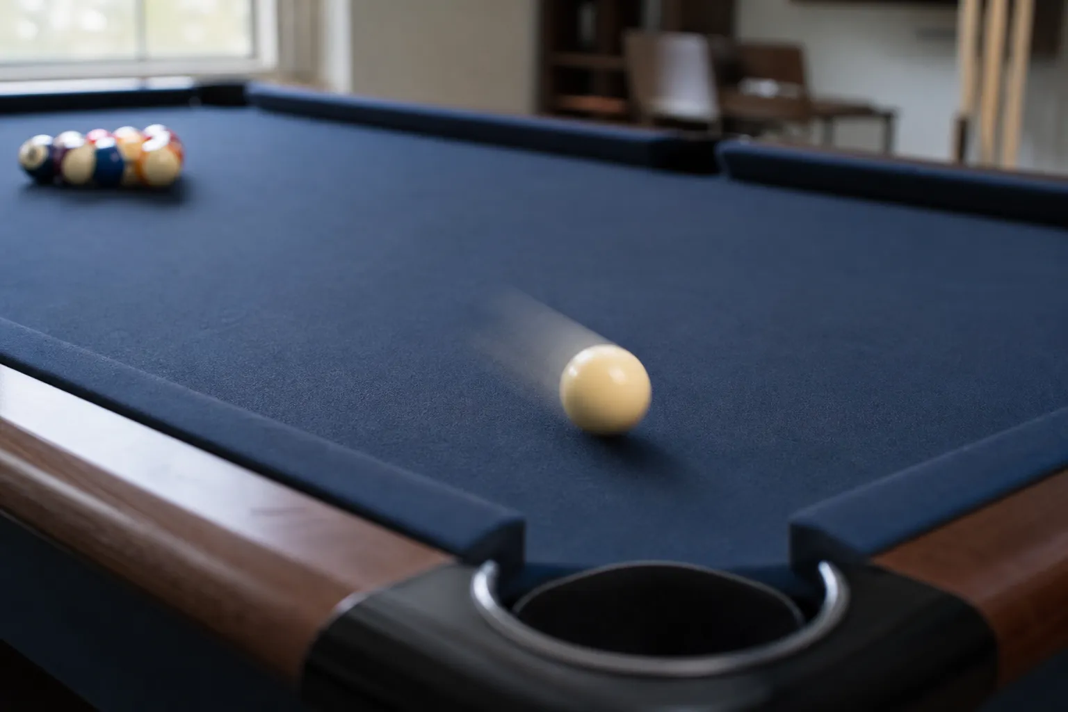 Cue ball rolling across clean pool table felt during final testing